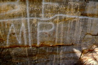 Graffiti on rock art panel