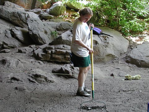 Figure 1.  Michelle Berg Vogel removing modern debris from Rockhouse Cave