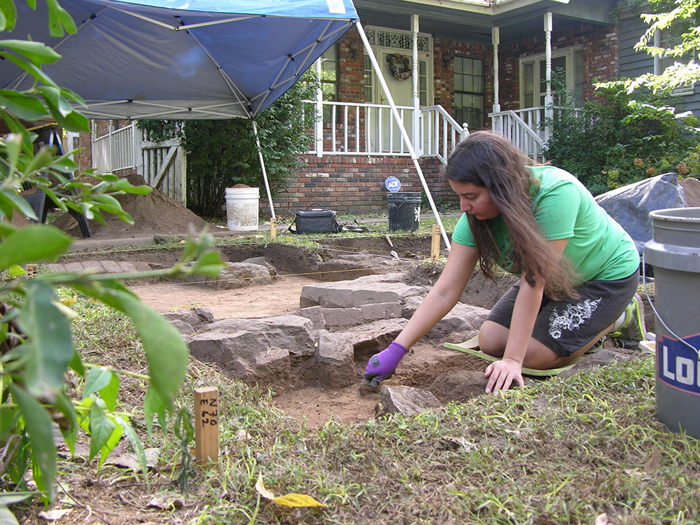 Volunteer Melinda Martin excavating at the Willhaf house.