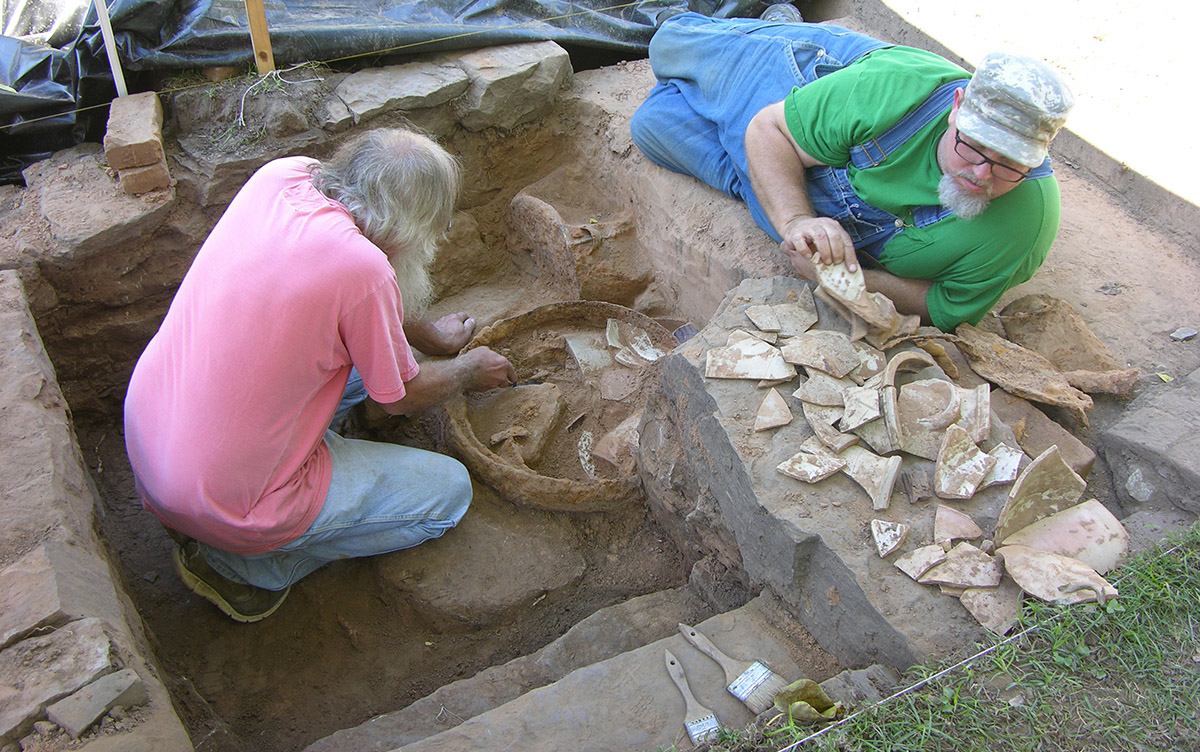 Survey archeologists Larry Porter and Jared Pebworth excavating the cellar steps at the Willhaf house.