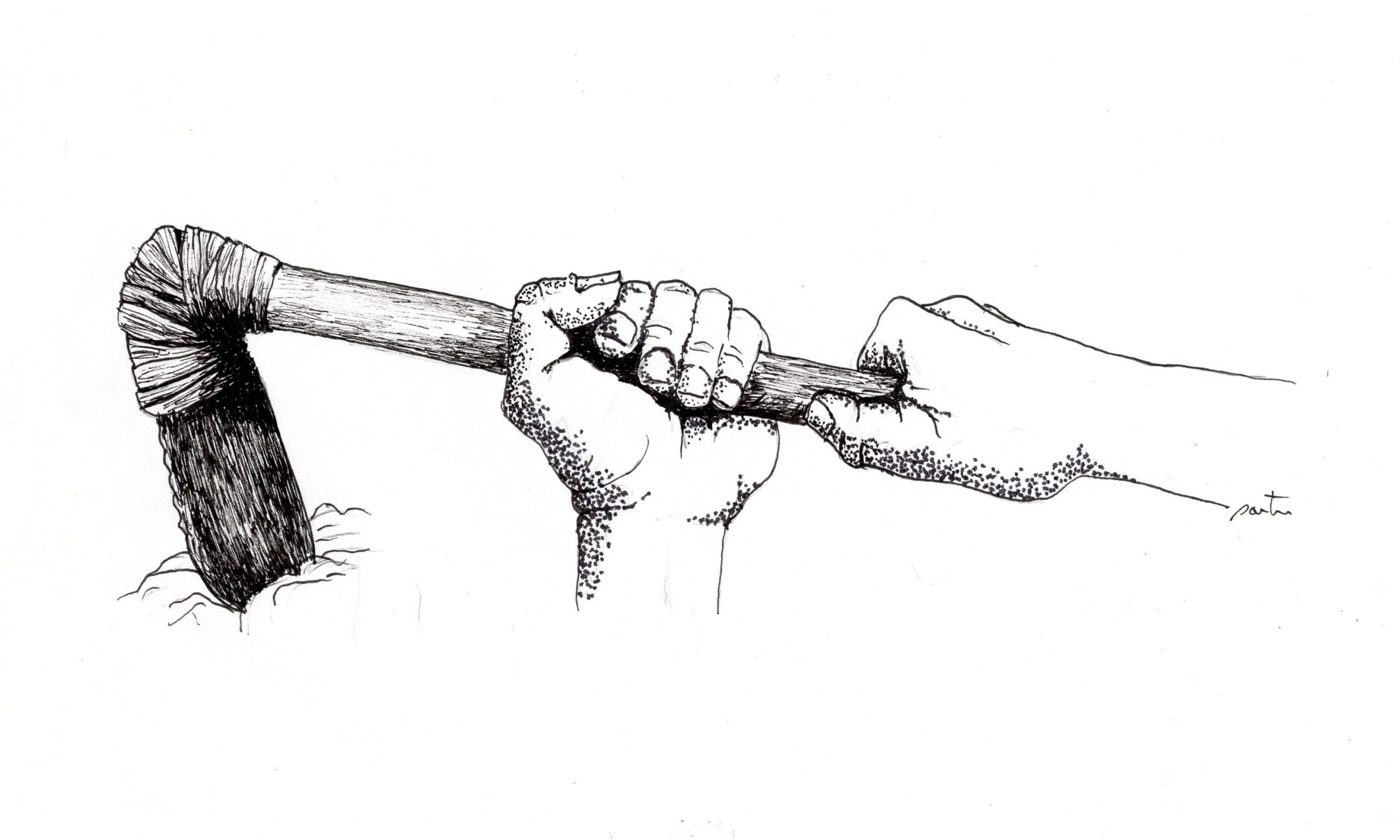 Hands using a tool to break up soil