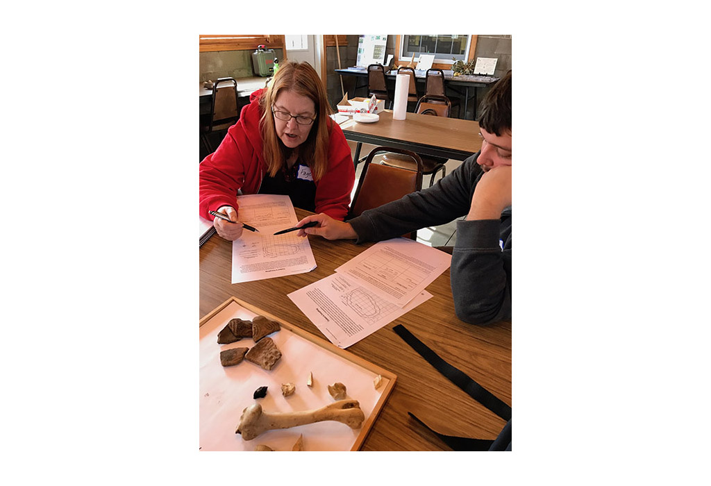 Two people looking at a piece of paper