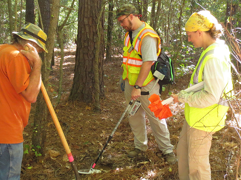 Larry Porter, Dr. Carl Drexler, and Michelle Rathgaber metal detecting at Camp Monticello