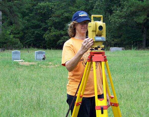 Dr. Mary Beth Trubitt mapping the Helms Cemetery in 2010.