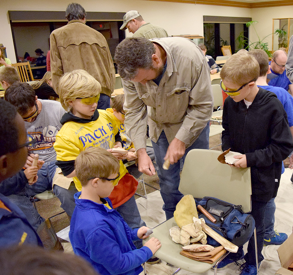 Mike Evans demonstrating flint knapping technique at the Janet Huckabee Arkansas River Valley Nature Center