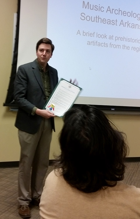 Monticello Mayor Zackery Tucker issuing an Archeology Month proclamation during the Tunican Chapter of the Arkansas Archeological Society’s monthly meeting on March 1st