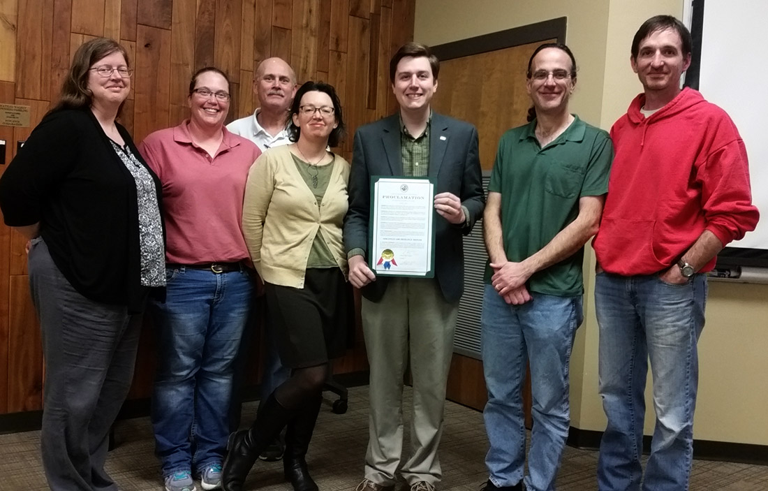 The Arkansas Archeological Society's Tunican Chapter officers and Board of Advisors with Monticello Mayor Zachery Tucker accepting the Archeology Month proclamation