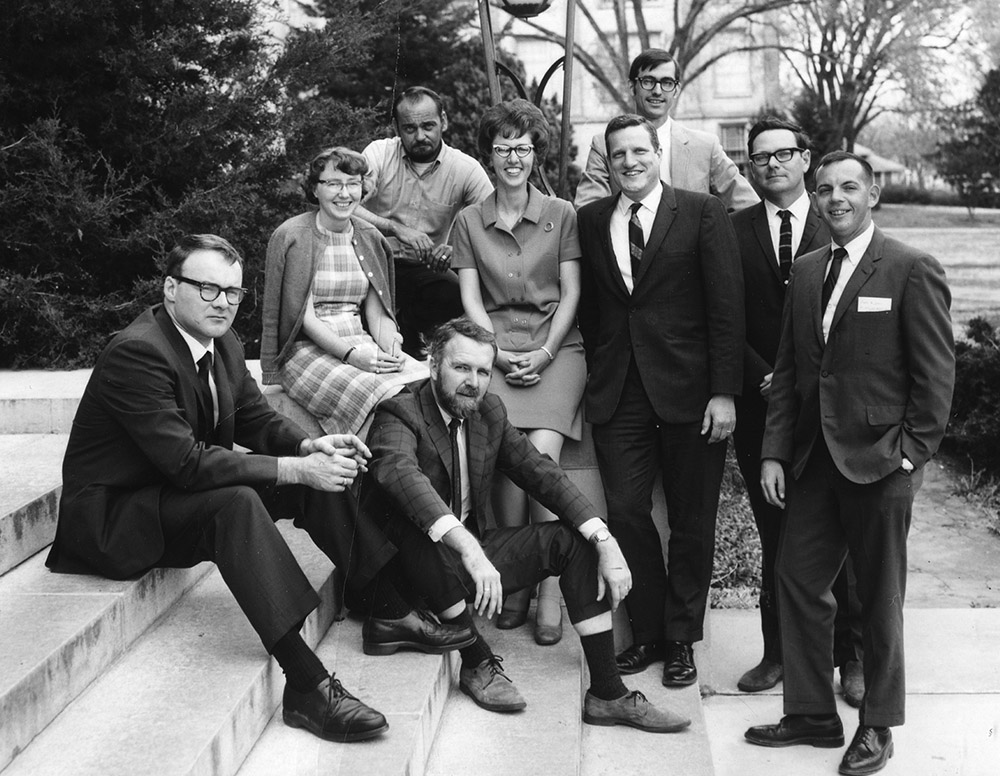 The Arkansas Archeological Survey's founders and first station archeologists in 1968. From left to right: Frank Schambach, Hester Davis, Burney McClurkan (top), Jim Scholtz (sitting), Martha Rolingson, Bob McGimsey, Ken Cole (above Bob), Dan Morse, and John Huner.