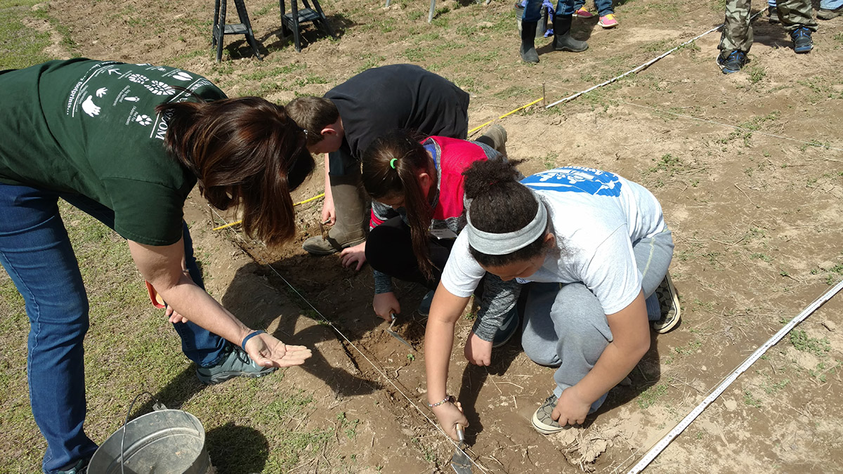 Project Dig students excavating.