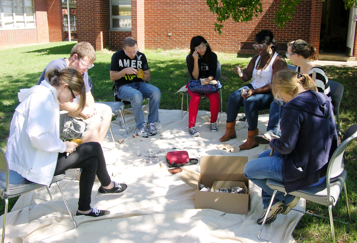 At the University of Arkansas – Fort Smith, students in Tim Mulvihill’s Introduction to Archeology course learn the basics of flint knapping.