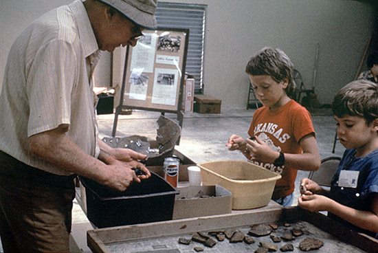 Society members John Jensen, Brandon Holder and Paul Russell in the lab washing artifacts during the 1986 dig.