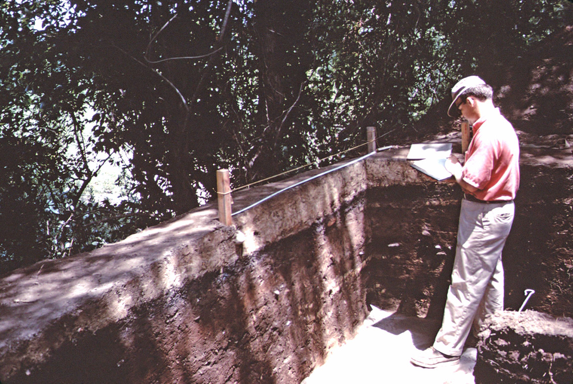 Archeologist Frank Schambach recording a cross section of deposits at the Bayou Sel saltmaking site in 1969.