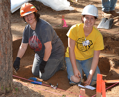 Forest Service archeologist Diana Angelo and Arkansas Archeological Society member Sarah Rosenkrans excavated post stains that formed part of a Caddo building at 3MN298.