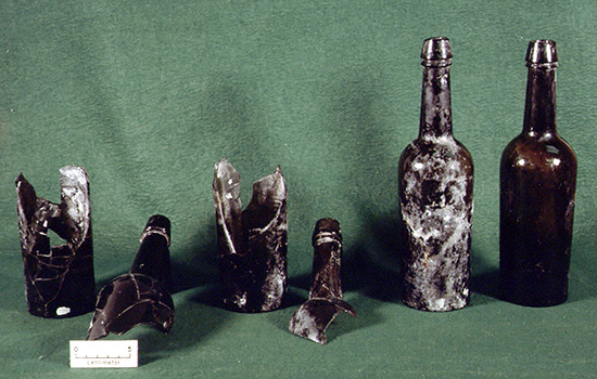 Dark green glass stout bottles from Arkansas Post cataloged for the National Park Service by the Arkansas Archeological Survey.