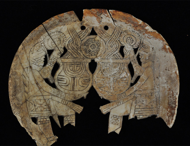 Engraved shell gorget (or, pendant) showing mythic scenes (University of Arkansas Museum Collections).