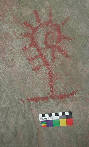 Prehistoric pictograph of a fiddlehead fern. 