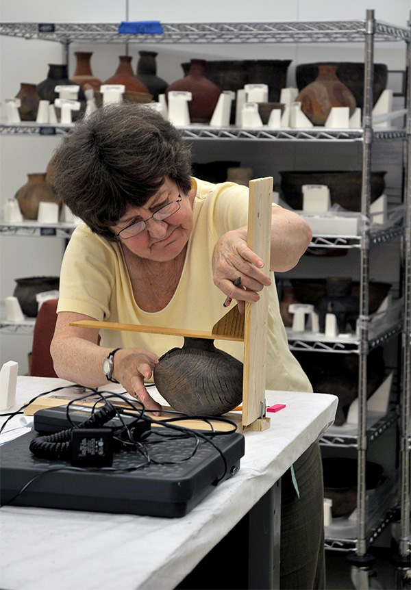 Dr. Ann Early (Arkansas State Archeologist) documenting Arkansas pottery collections at the National Museum of the American Indian collection facility in Suitland, MD.