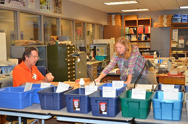 Volunteers Leanda Gavin and Steve Longacre assist in processing the Sargent Collection.