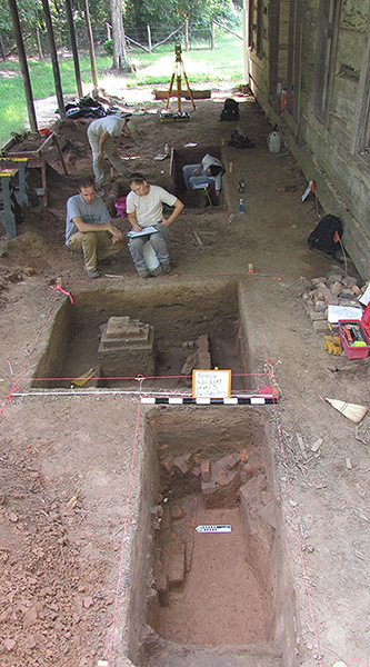 Dr. Emily Beahm and Devin Pettigrew mapping a unit profile while investigating a cellar at Hollywood Plantation in Drew County, 2014.