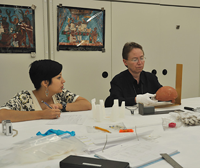 Osage Tribal Historic Preservation Officer Dr. Andrea Hunter (right) and assistant June Carpenter (left) documenting Carden Bottoms vessels at the National Museum of the American Indian.