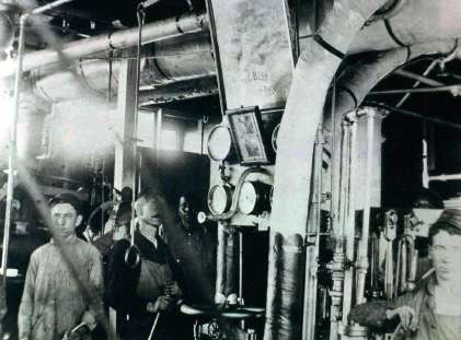 Photo of similar steam gauges in use in an engine room.