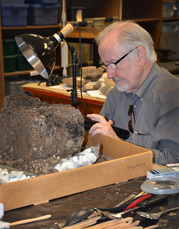 Professor David Stahle, a leading expert in tree-ring studies, examines the possible Parkin cross base.