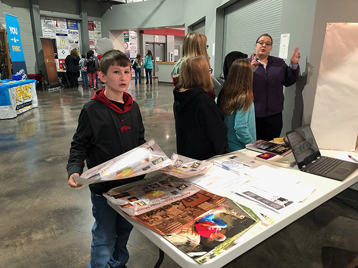 ASU station assistant Sarah Stuckey talking with Highland Middle School at their career day.