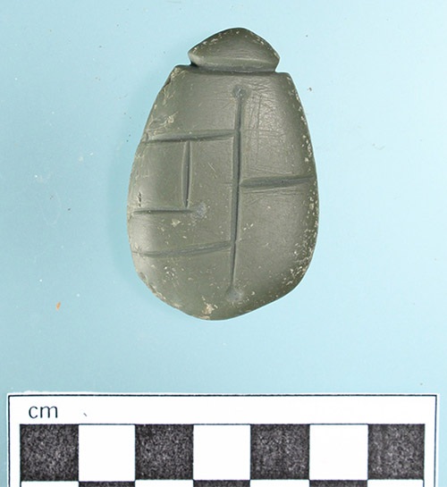 This carved stone pendant was found at the Powell Canal site (3CH14) in Chicot County, Arkansas along with other cultural features associated with the Baytown and Coles Creek periods (AD 400–1100).