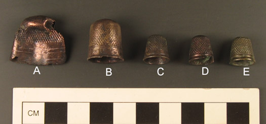 Figure 6. Thimbles from Feature 1 at Davidsonville (thimble e, at the far right, was found in the leather pouch).