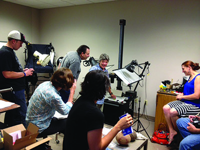 Jane Kellett (center) teaching a digital photography workshop to ARAS staff in 2014 Jane Kellett (center) teaching a digital photography workshop to ARAS staff in 2014