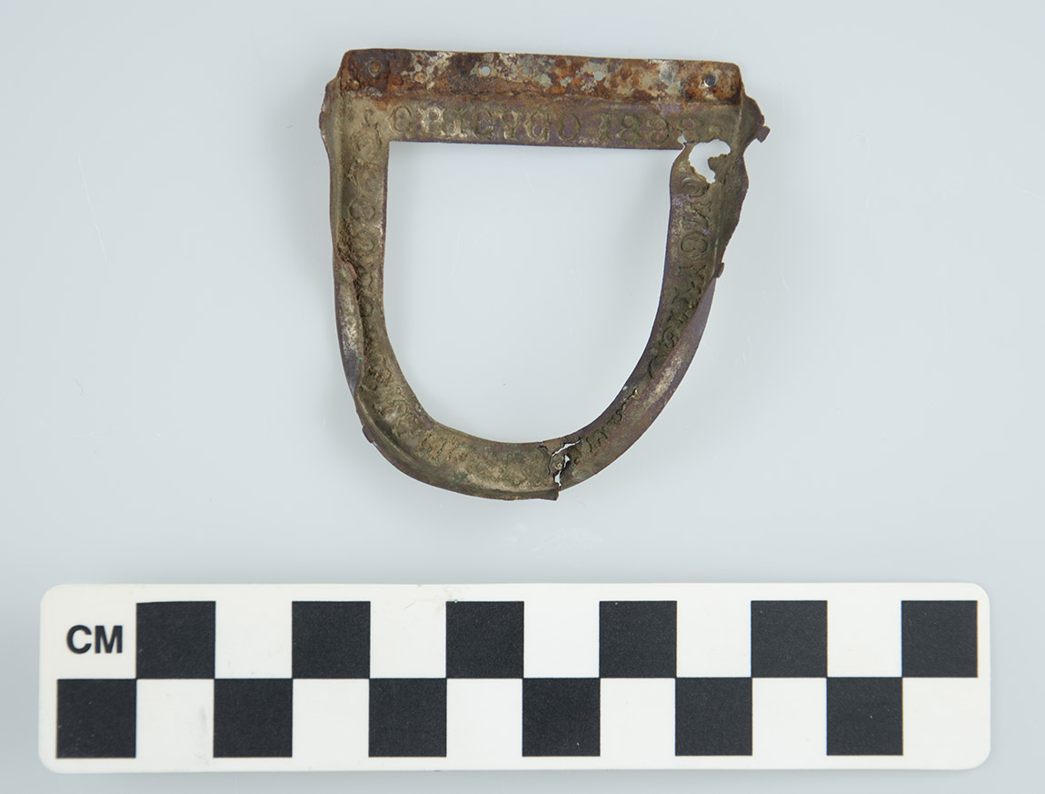 The frame of this badge is stamped with the words "Columbia Exposition Chicago 1893” along the top. It was one of the many late 19th century artifacts recovered during the 1983 Moser Site  (3BE311) excavations  in Benton County, Arkansas.  Photo Record: 3BE311-82-1008-161