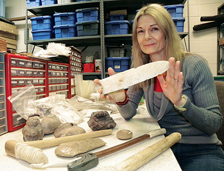 Figure 4. Morrow holding cast of Poinsett County Sloan point cast by Pete Bostrom (Photo by Sherry Pruitt, courtesy of the Jonesboro Sun).