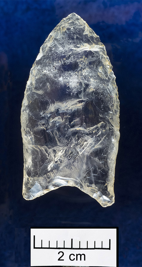 This Paleoindian quartz crystal Clovis point was found by Forest Sargent in the Ouachita Mountains. It is one of the oldest Arkansas made implements still in existence today.