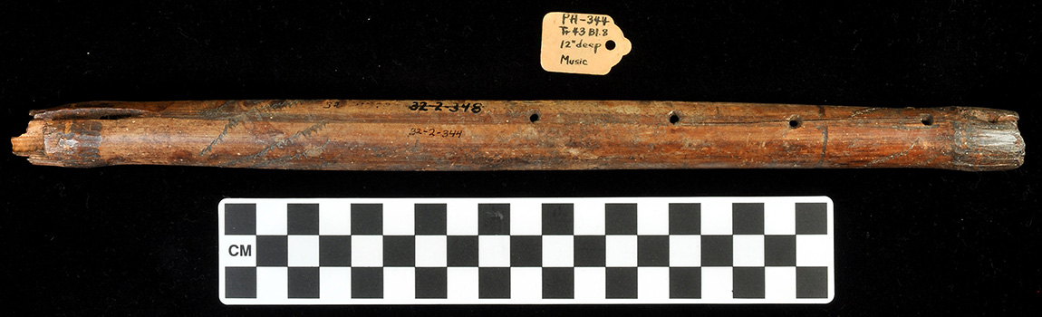 The Breckenridge flute (32-2-348, U of A Museum Collections) is a two-chambered block and fipple external duct flute made of river cane. With an AMS date range of AD 1020-1160, it is the oldest known example of this type. Photo by Leslie Walker.