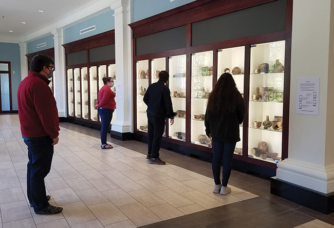 Visitors view items from the JEC Hodges collection on open storage exhibit at the Caddo Center on the HSU campus. Visitors view items from the JEC Hodges collection on open storage exhibit at the Caddo Center on the HSU campus.