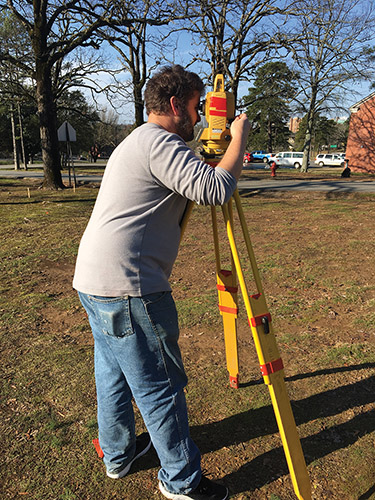 Robert Scott (ARAS-UAPB) uses the total station to map an area where unmarked graves are suspected at Arkansas School for the Deaf in Little Rock. Robert Scott (ARAS-UAPB) uses the total station to map an area where unmarked graves are suspected at Arkansas School for the Deaf in Little Rock.