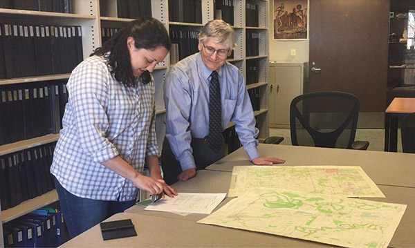 Archeological sites recorded into our AMASDA database passed the 50,000 mark this year. Here, Sarah Shepard (ARAS Assistant Registrar) officially puts the stamp onto the site form, with ARAS Director George Sabo looking on. Archeological sites recorded into our AMASDA database passed the 50,000 mark this year. Here, Sarah Shepard (ARAS Assistant Registrar) officially puts the stamp onto the site form, with ARAS Director George Sabo looking on.