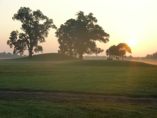 View of the Summer sun setting behind Mound S